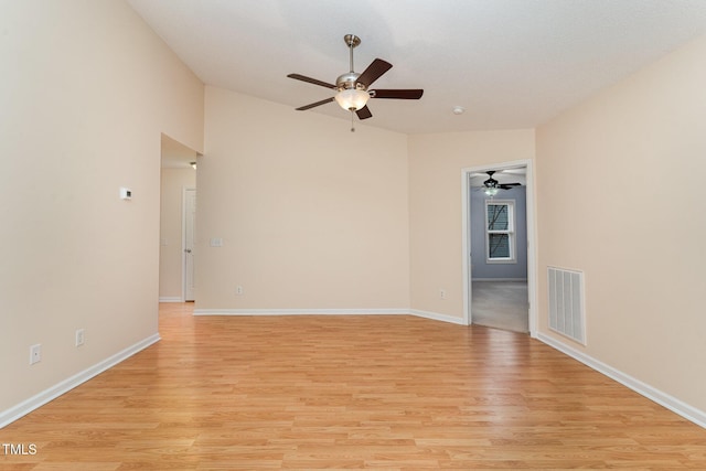 1603 Stonegate S, Sanford, NC 27332 - unfurnished room with light wood finished floors, vaulted ceiling, visible vents, and a ceiling fan