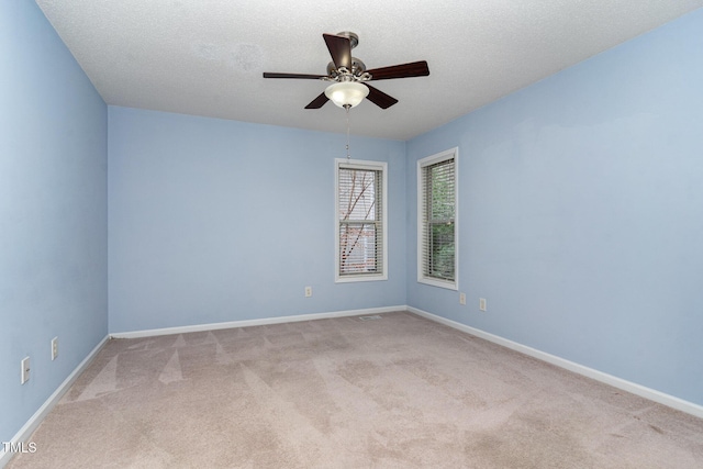 1603 Stonegate S, Sanford, NC 27332 - carpeted spare room with baseboards, a textured ceiling, and a ceiling fan