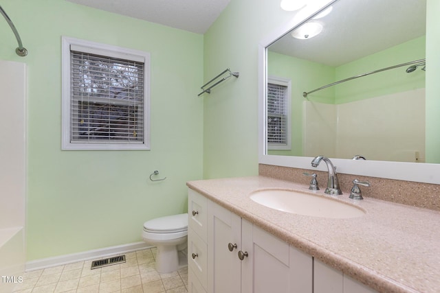 1603 Stonegate S, Sanford, NC 27332 - bathroom with tile patterned floors, toilet, vanity, baseboards, and visible vents