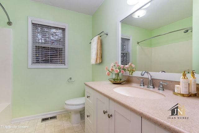 1603 Stonegate S, Sanford, NC 27332 - full bathroom featuring toilet, vanity, tile patterned flooring, baseboards, and visible vents