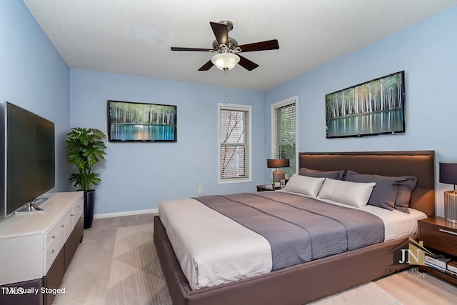 1603 Stonegate S, Sanford, NC 27332 - bedroom featuring a ceiling fan, baseboards, and light colored carpet