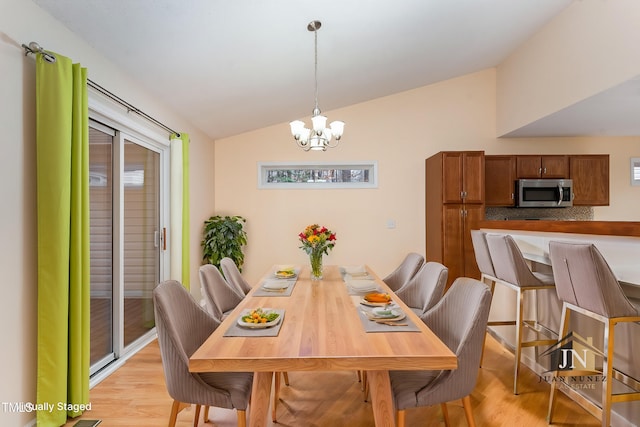 1603 Stonegate S, Sanford, NC 27332 - dining room with vaulted ceiling, an inviting chandelier, and light wood finished floors