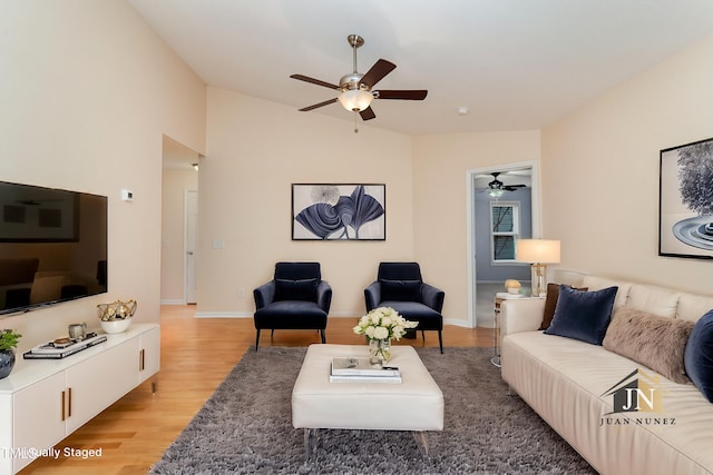 1603 Stonegate S, Sanford, NC 27332 - living area featuring baseboards, vaulted ceiling, light wood-style floors, and a ceiling fan