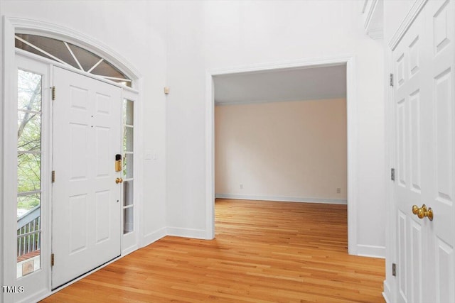 entryway featuring light wood-type flooring and baseboards