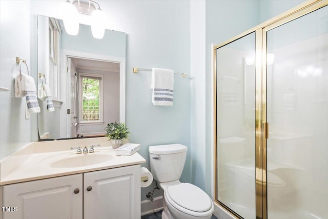 full bath with a stall shower, toilet, and vanity