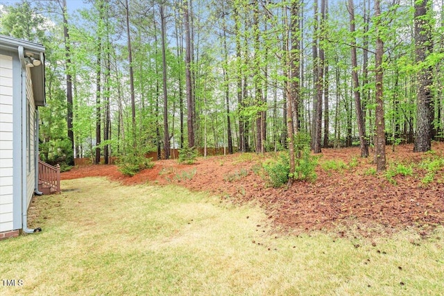 view of yard featuring a view of trees