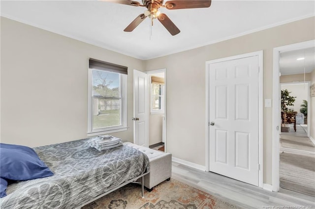 1002 Hicks Ave, Fayetteville, NC 28304 - bedroom with baseboards, light wood-type flooring, and a ceiling fan