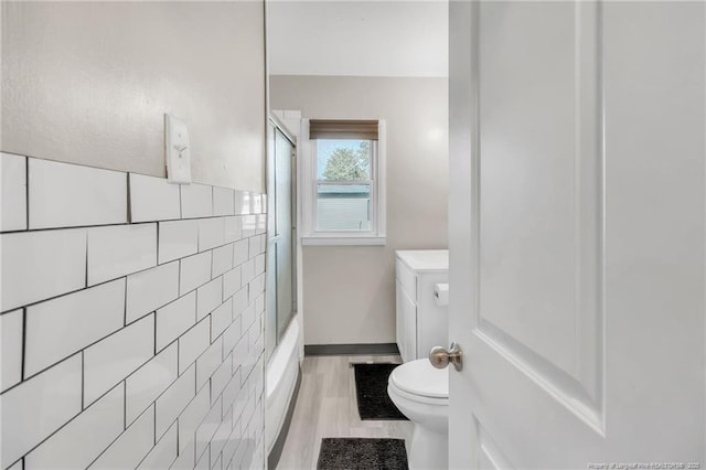 1002 Hicks Ave, Fayetteville, NC 28304 - full bath with toilet, tile walls, and wood finished floors