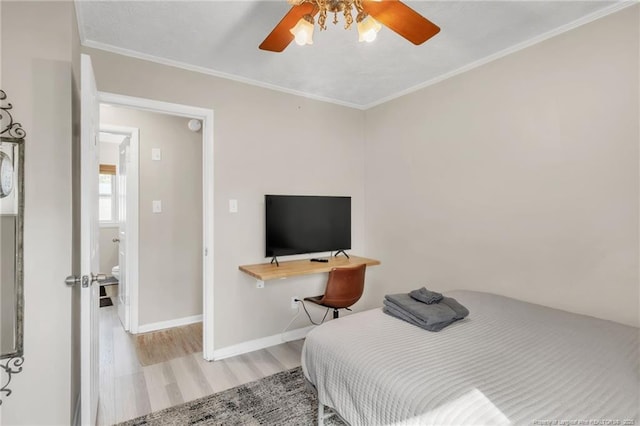 1002 Hicks Ave, Fayetteville, NC 28304 - bedroom featuring a ceiling fan, light wood-style flooring, ornamental molding, and baseboards