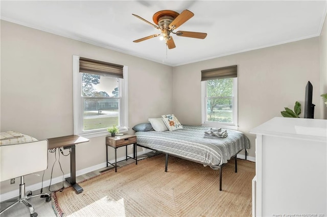 1002 Hicks Ave, Fayetteville, NC 28304 - bedroom with multiple windows, crown molding, ceiling fan, and baseboards