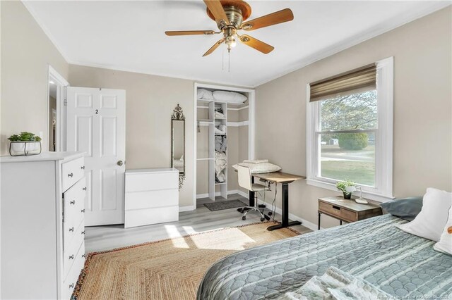 1002 Hicks Ave, Fayetteville, NC 28304 - bedroom featuring a closet, light wood finished floors, baseboards, ornamental molding, and a ceiling fan