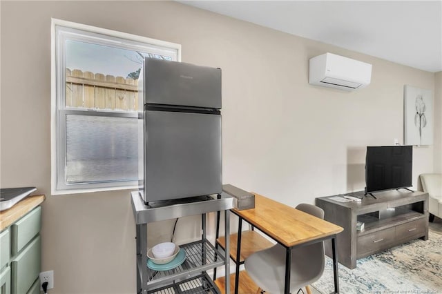 1002 Hicks Ave, Fayetteville, NC 28304 - interior space with freestanding refrigerator and a wall unit AC