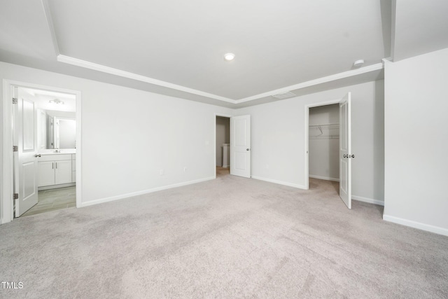 3025 Castle Loch Ln, Durham, NC 27703 - unfurnished bedroom with a tray ceiling, carpet floors, and baseboards