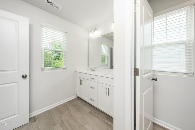 3025 Castle Loch Ln, Durham, NC 27703 - bathroom with vanity and baseboards