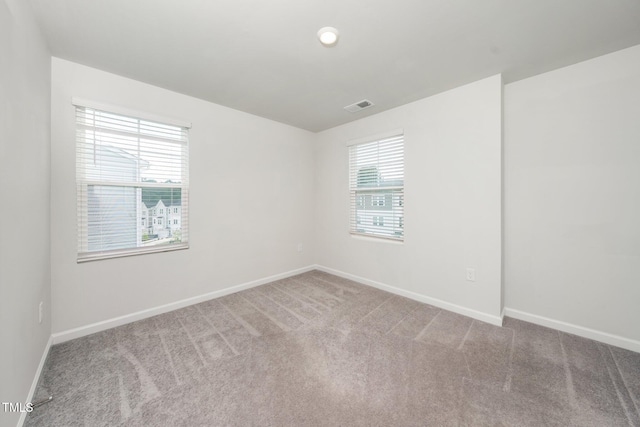 3025 Castle Loch Ln, Durham, NC 27703 - carpeted empty room featuring baseboards