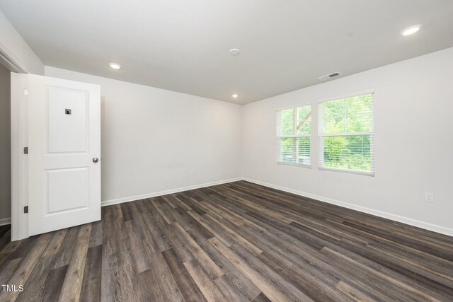 3025 Castle Loch Ln, Durham, NC 27703 - unfurnished room with dark wood-type flooring, baseboards, and recessed lighting