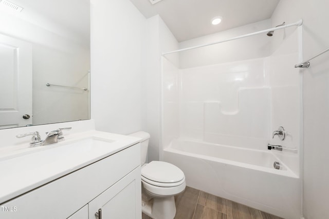 3025 Castle Loch Ln, Durham, NC 27703 - full bath with vanity, toilet, wood finished floors, shower / bath combination, and recessed lighting