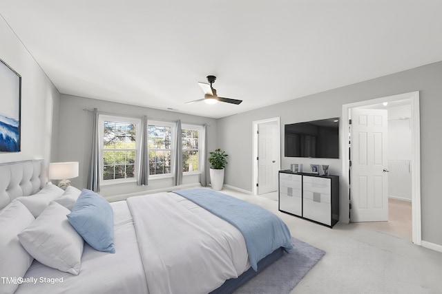 bedroom featuring light colored carpet, baseboards, and ceiling fan