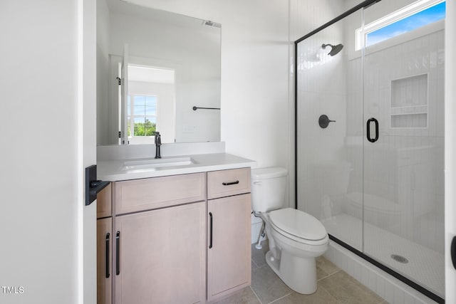 8620 Dukes Lake Rd, Zebulon, NC 27597 - bathroom featuring a stall shower, vanity, plenty of natural light, and tile patterned flooring
