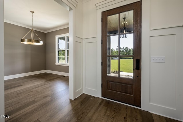 8620 Dukes Lake Rd, Zebulon, NC 27597 - foyer featuring dark wood-style floors and ornamental molding