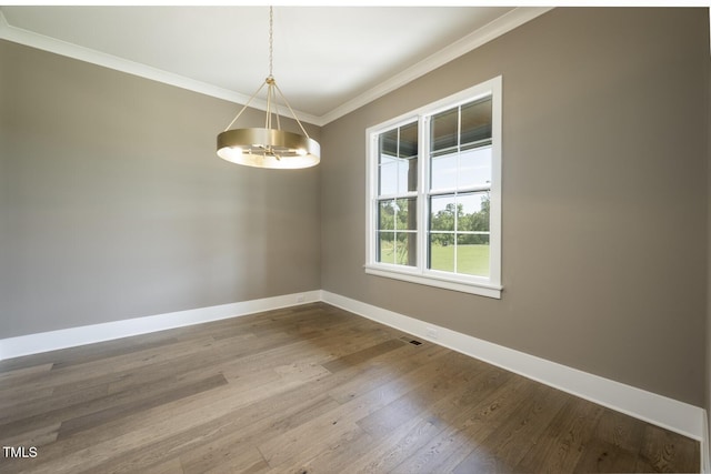8620 Dukes Lake Rd, Zebulon, NC 27597 - empty room with ornamental molding, a chandelier, and wood finished floors