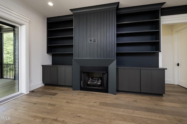 8620 Dukes Lake Rd, Zebulon, NC 27597 - unfurnished living room featuring wood finished floors and recessed lighting