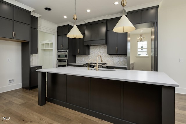 8620 Dukes Lake Rd, Zebulon, NC 27597 - kitchen with decorative backsplash, light countertops, wood finished floors, decorative light fixtures, and recessed lighting