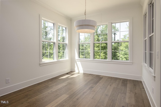 8620 Dukes Lake Rd, Zebulon, NC 27597 - unfurnished dining area featuring baseboards and dark wood-type flooring