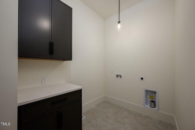 8620 Dukes Lake Rd, Zebulon, NC 27597 - laundry area featuring hookup for a washing machine, electric dryer hookup, cabinet space, and light tile patterned floors