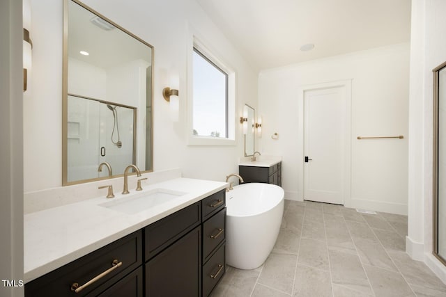 8620 Dukes Lake Rd, Zebulon, NC 27597 - full bathroom with a shower stall, two vanities, and a freestanding bath