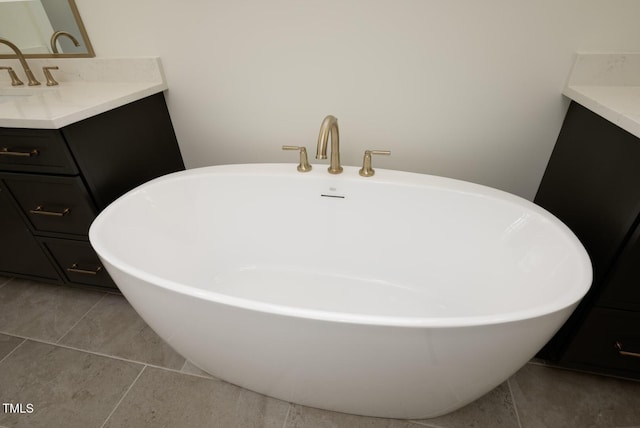 8620 Dukes Lake Rd, Zebulon, NC 27597 - full bath with vanity, a freestanding bath, and tile patterned flooring