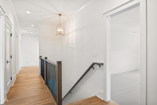 8620 Dukes Lake Rd, Zebulon, NC 27597 - corridor with an upstairs landing, recessed lighting, light wood-style floors, and a chandelier