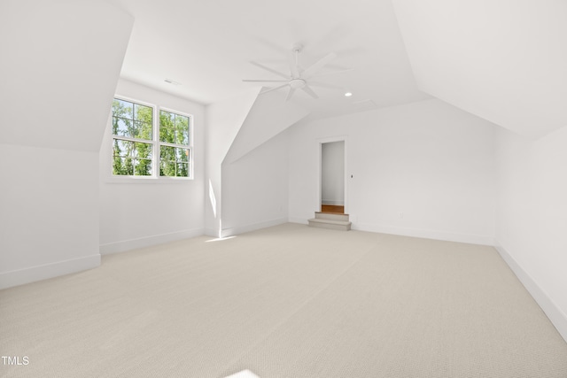 8620 Dukes Lake Rd, Zebulon, NC 27597 - additional living space with vaulted ceiling, a ceiling fan, and light carpet