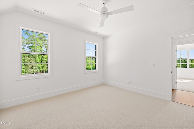 8620 Dukes Lake Rd, Zebulon, NC 27597 - spare room with light carpet, plenty of natural light, and ceiling fan