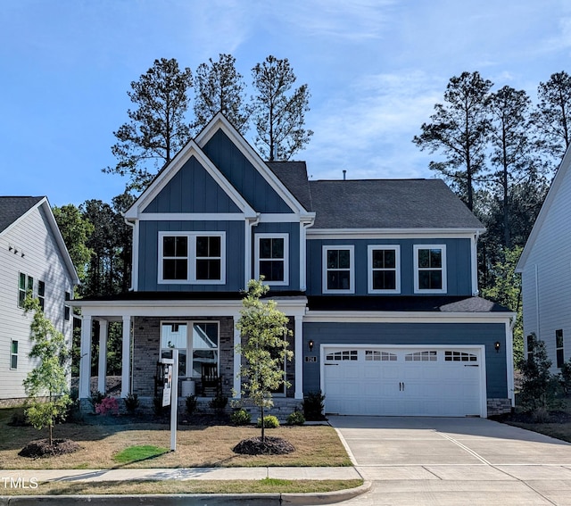 craftsman-style house featuring board and batten siding, concrete driveway, and an attached garage