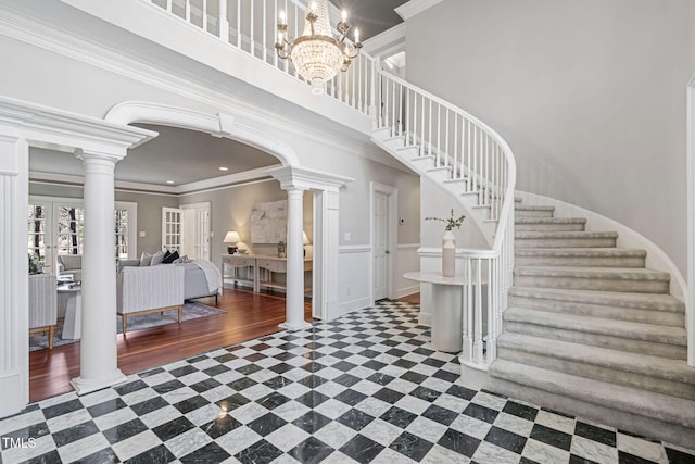 100 Dunedin Ct, Cary, NC 27511 - foyer with stairs, crown molding, decorative columns, french doors, and a chandelier