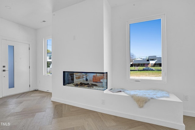 foyer featuring baseboards