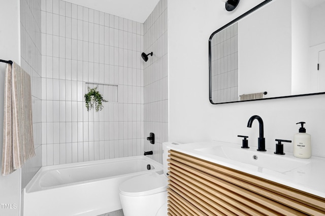 full bathroom featuring toilet, vanity, and bathtub / shower combination