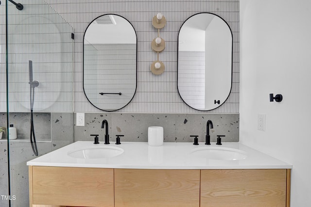 full bath with a sink and double vanity