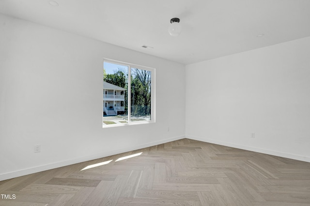 unfurnished room featuring baseboards