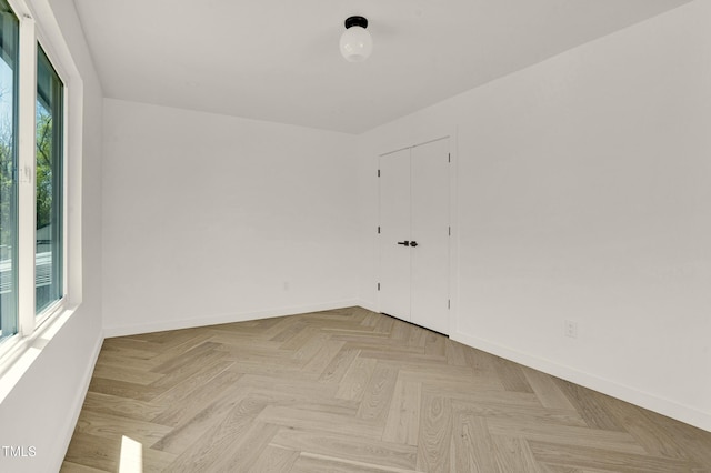 spare room featuring baseboards