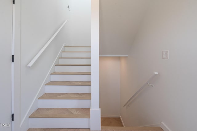 stairway featuring baseboards