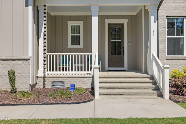 50 Gadwall Ct, Zebulon, NC 27597 - entrance to property with a porch and board and batten siding