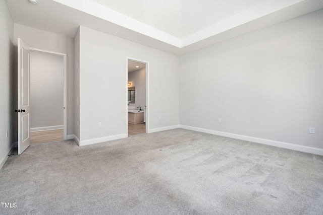 50 Gadwall Ct, Zebulon, NC 27597 - unfurnished bedroom featuring carpet flooring, baseboards, and ensuite bath