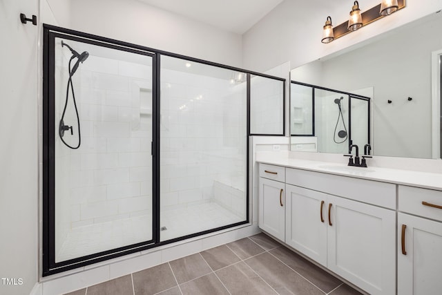 50 Gadwall Ct, Zebulon, NC 27597 - bathroom featuring vanity, tile patterned floors, and a stall shower