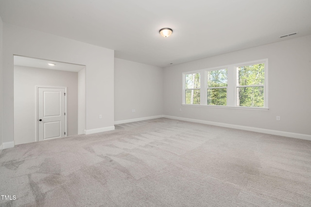 50 Gadwall Ct, Zebulon, NC 27597 - carpeted spare room featuring visible vents and baseboards