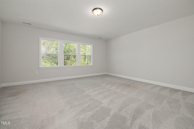 50 Gadwall Ct, Zebulon, NC 27597 - spare room featuring baseboards, visible vents, and light carpet