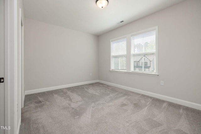 50 Gadwall Ct, Zebulon, NC 27597 - carpeted spare room featuring baseboards and visible vents
