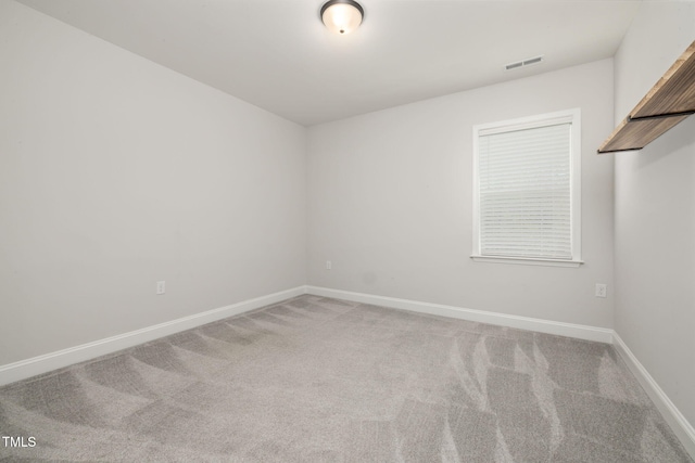 50 Gadwall Ct, Zebulon, NC 27597 - spare room with baseboards, visible vents, and light carpet