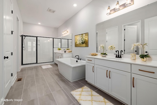 50 Gadwall Ct, Zebulon, NC 27597 - full bathroom with a sink, a freestanding bath, a stall shower, and visible vents